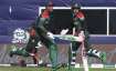 Bangladesh's Shakib Al Hasan and teammate Mushfiqur Rahim cross as they run between the wickets duri