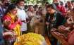 Srinagar: Relatives of M L Bindroo pray for him during his