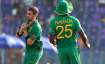 South Africa's Anrich Nortje, left, takes a catch to dismiss Bangladesh's Mahedi Hasan during the Cr