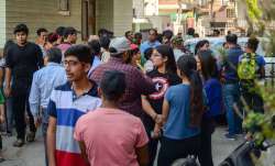 Students and parents gather outside a coaching center in