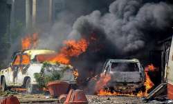 Smoke billows out of burning cars during 'Bharat Bandh'