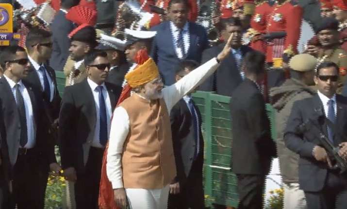 PM Modi grees children at Rajpth as Republic Day parade