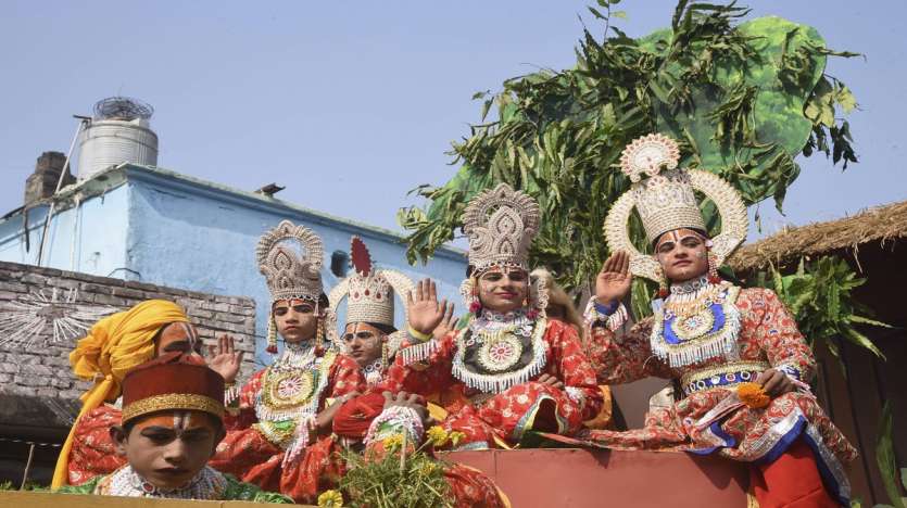 A tableau depicting Lord Ram passes through a street on the eve of Diwali festival, in Ayodhya