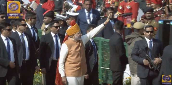 PM Modi grees children at Rajpth as Republic Day parade