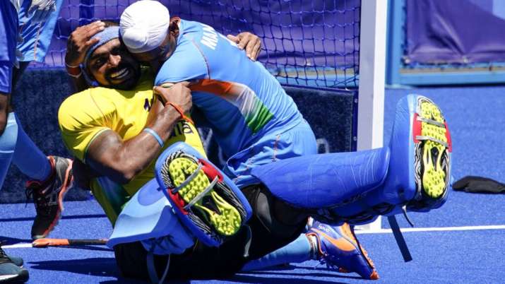 India goalkeeper Sreejesh Parattu Raveendran, left, celebrates with Mandeep Singh